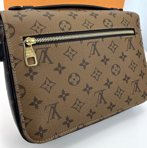 Louis Vuitton pochette metis in monogram reverse canvas