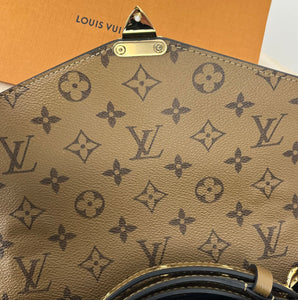 Louis Vuitton pochette metis in monogram reverse canvas