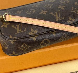 Louis Vuitton pochette accessories in monogram