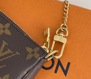 Louis Vuitton Vivienne holiday mini pochette