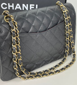 Chanel classic medium double flap in black caviar