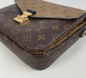 Louis Vuitton pochette metis in monogram reverse canvas