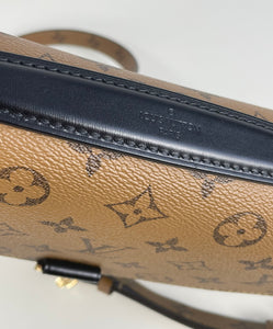 Louis Vuitton pochette metis in monogram reverse canvas